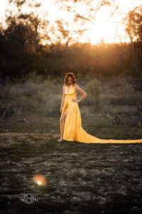 Model reflecting on the day during a sunset setting photography session