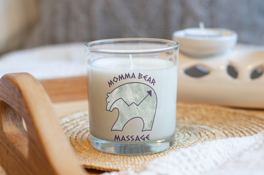 Momma Bear Massage graphic desing logo displayed on candle