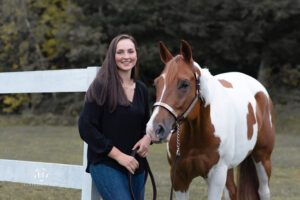 Girl with horse posing for senior photos